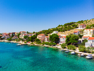 Fototapeta na wymiar Croatia. Summer. Sunny day. Coast of the Adriatic Sea. Small town by the sea. Holiday season. Popular tourist spot