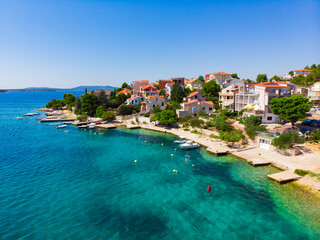 Fototapeta na wymiar Croatia. Summer. Sunny day. Coast of the Adriatic Sea. Small town by the sea. Holiday season. Popular tourist spot. Drone. Aerial view