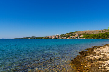 Croatia. Summer. Sunny day. Rocky shore of the Adriatic Sea. Tourist season. Popular holiday destination