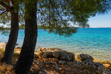 Fototapeta na wymiar Croatia. Summer. Sunny day. Rocky shore of the Adriatic Sea. Tourist season. Popular holiday destination