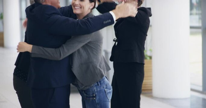 Success is worth the wait. 4k footage of a group of businesspeople celebrating their success.