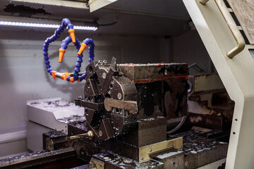 Metal processing machine. Detail of a tool in production