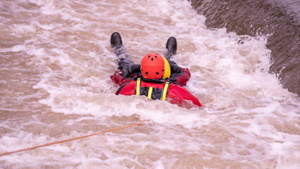 Fireman during whitewater rescue training 