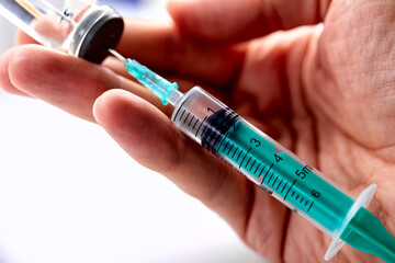  Vaccine in vial with syringe