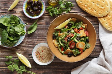 Fattoush Salad. Lebanese vegetables salad with roasted flatbread. Selective focus