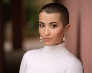 portrait of a young sexy woman with short hair in white golf