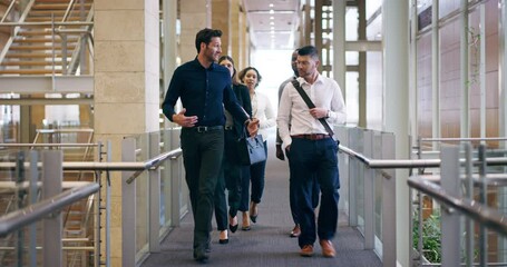 Walking in, ready for business. 4k video footage of a group of businesspeople walking through their office building. - Powered by Adobe