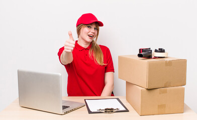 red head pretty woman feeling proud,smiling positively with thumbs up. employee concept