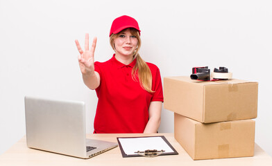 red head pretty woman smiling and looking friendly, showing number three. employee concept