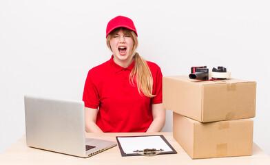 red head pretty woman shouting aggressively, looking very angry. employee concept