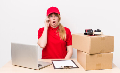 red head pretty woman looking surprised, realizing a new thought, idea or concept. employee concept