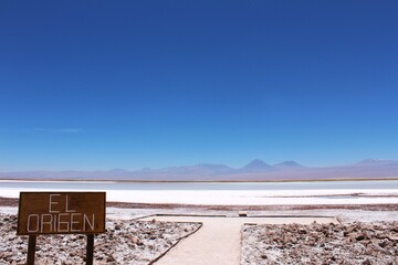 Landscape view of Tebinquinche Lake and spanish sign 