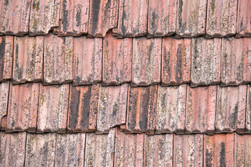 Closeup surface of old weathered ceramic tiles covering building roof