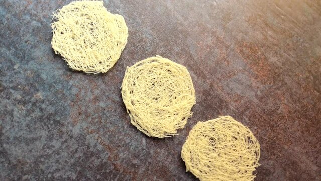 Raw whole dried round string hopper rice noodles