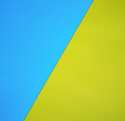Abstract blue yellow background. Colors of the flag of Ukraine. Textured paper
