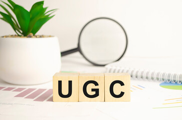 User generated content, UGC acronym on wood cubes