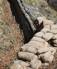 sandbags to protect the trench dug in the ground by soldiers during the war