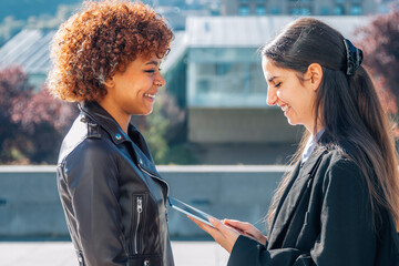 girls in the street with tablet