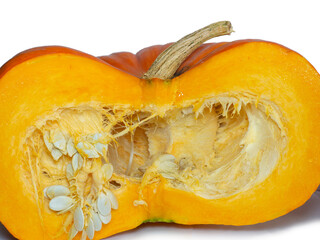 Cut pumpkin on a white background. Pumpkin isolate. Vegetable cut in half.