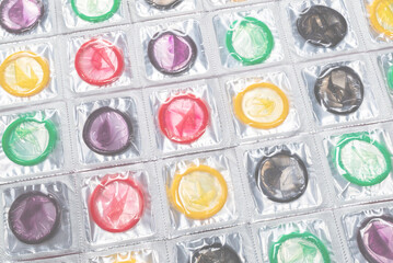 Colorful condoms background.