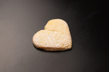 Shortbread in the shape of a heart isolated on white background.