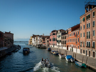 typical canal in venice with boats