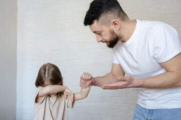 Father punishing his child, domestic violence concept. - obrazy, fototapety, plakaty