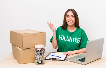 hispanic pretty woman feeling happy, surprised realizing a solution or idea. donations volunteer
