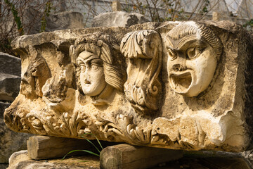 Stone Theater masks in Myra Ancient City. Demre, Antalya, Turkey