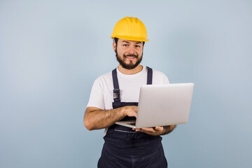 Hispanic man Professional engineering and worker with computer and helmet in Mexico Latin America