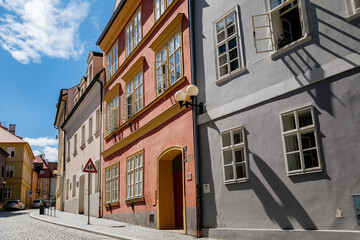 Cheb, Western Bohemia, Czech Republic, 14 August 2021: narrow picturesque street with medieval colorful gothic merchant houses, Eger at sunny summer day, historic renaissance and baroque buildings