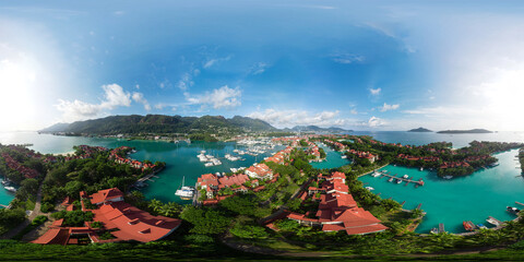 Seamless spherical 360 degree HDRI aerial panorama of Eden Island, Victoria, Seychelles. View of a luxury tourist hotel with beaches and a harbor for yachts, catamarans and boats