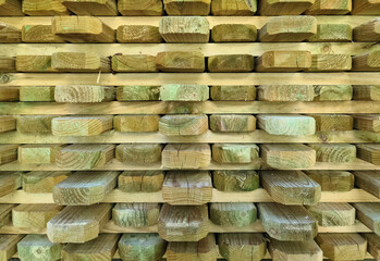 A stack of wooden boards for handicraft construction.