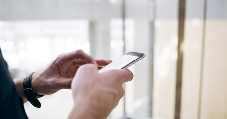 Business is about connections. Young caucasian business man using phone to send online text messages chat at work. Closeup of hands businessman going up in an office elevator while using social media