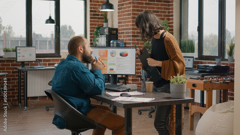 Poster business man asking for help from woman to design rate charts on computer monitor. entrepreneur and 