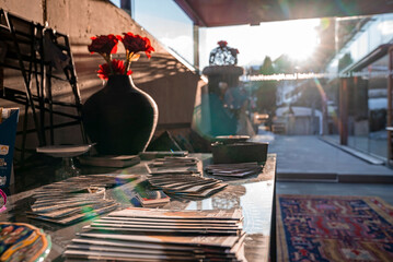 St. Anton am Arlberg. March 10, 2022. Assorted magazines placed on table in lobby at modern hotel, Various magazines with flower pots on table at hotel