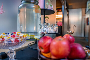 St. Anton am Arlberg. March 10, 2022. Fresh lemonade with lime in glass jug on table at modern hotel, Jug of fresh lemonade in clear glass jug on table