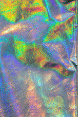 Holographic background. wallpaper In silver, purple and green colors.metal holographic material....