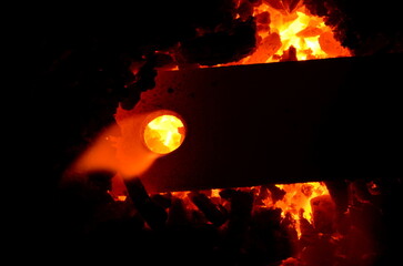 The process of heating a metal product on fire.