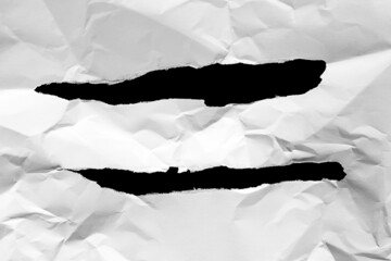 Grungy torn white paper on black background design element.