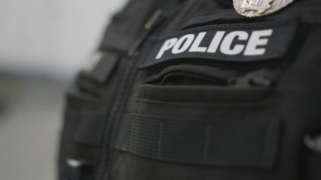 Police patch sign on a bulletproof vest