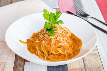 Pasta spaghetti Bolognese on white bowl side view