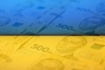 Defocus ukrainian money backdrop. Background of the five hundred hryvnia banknotes. Close-up view. Ukraine economic. Paper money. Finance concept. Ukrainian flag. Out of focus