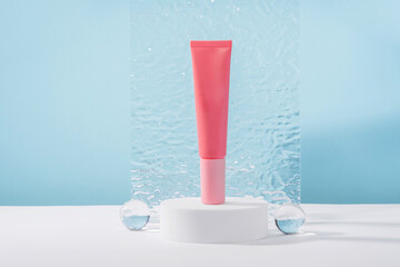 Unbranded cosmetic cream mockup on pedestal podium with stylish props, glass balls and acrylic...
