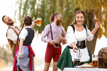 Drunk people celebrating Octoberfest outdoors