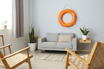 Interior of modern living room with lifebuoy and sofa