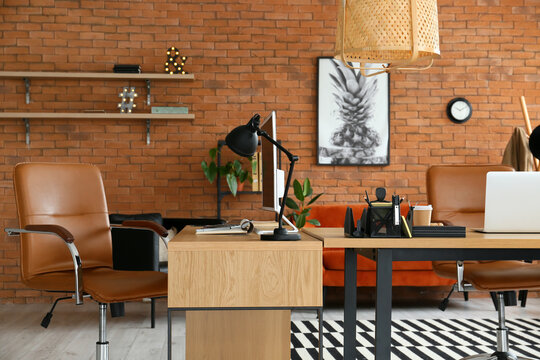 Workplaces with modern computers in stylish office