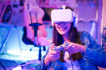 Young asian woman is using virtual reality headset. Neon light studio portrait. Concept of virtual...