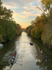 North Branch Chicago River at sunset with row boats, scull, row team