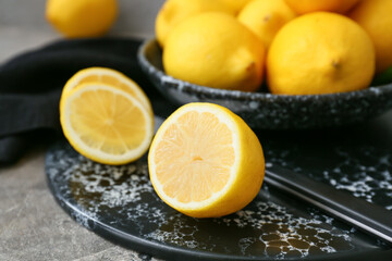 Fototapeta na wymiar Fresh cut lemon on grey table, closeup